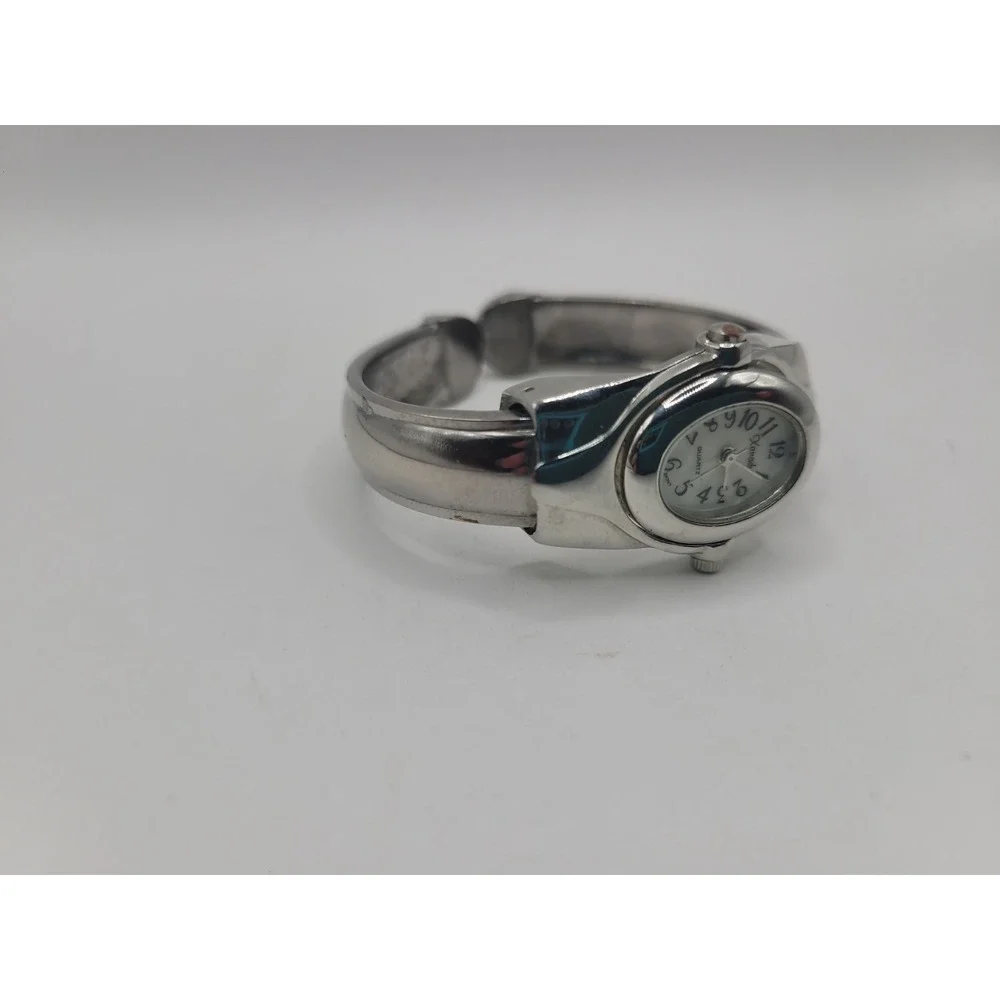 Xanadu Women's Silver Tone Hinged Cuff Bangle Quartz Watch Oval Dial Reverse